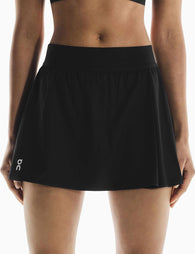 On Running | Court Skirt Pleated - Black | The Sports Edit