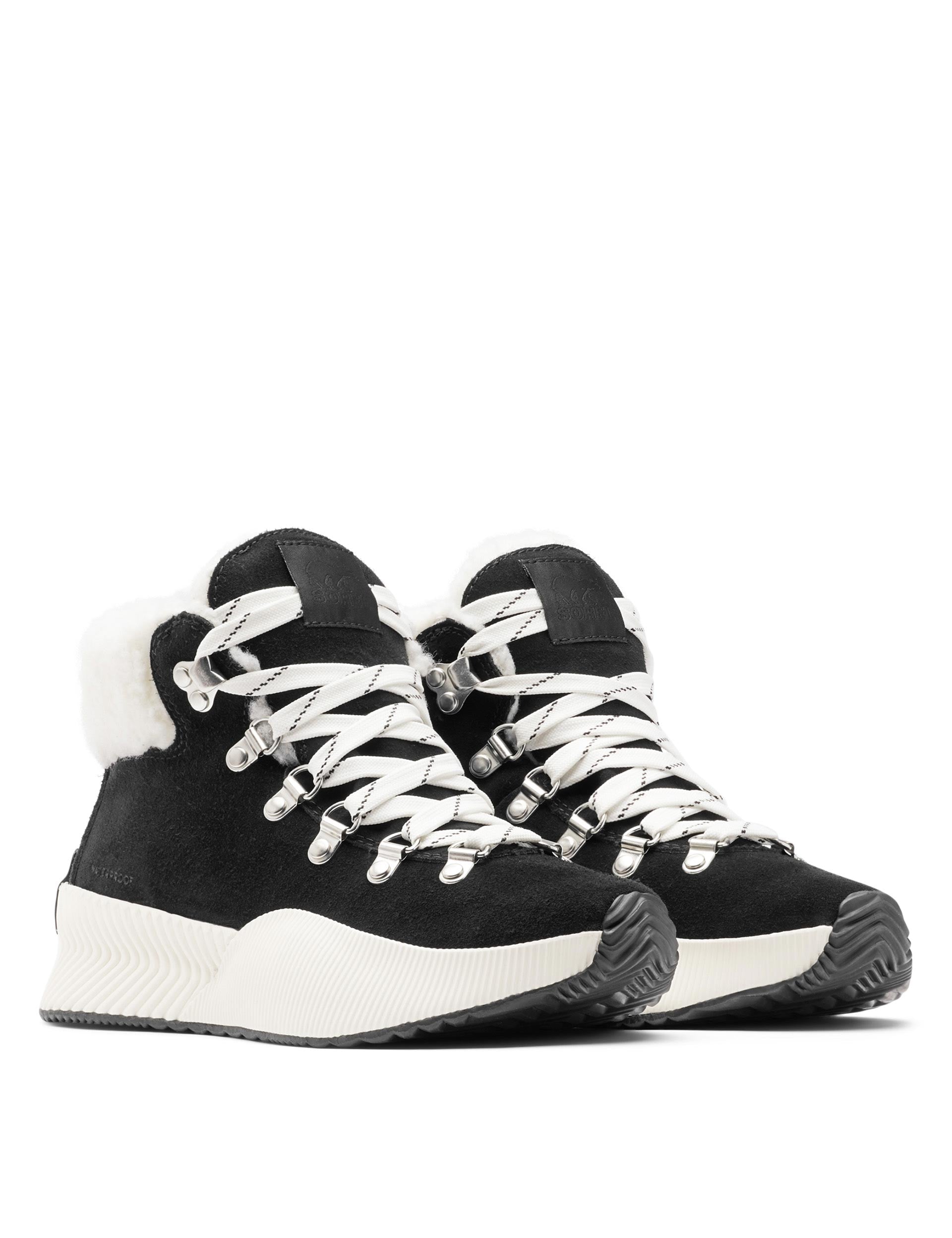 Sorel black clearance and white boots